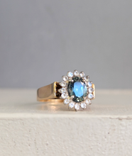 Load image into Gallery viewer, 1980s Halo ring with Teal sapphire and white spinel in 9ct yellow and white gold.