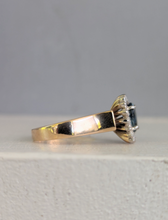 Load image into Gallery viewer, 1980s Halo ring with Teal sapphire and white spinel in 9ct yellow and white gold.