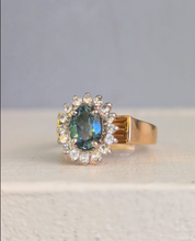 Load image into Gallery viewer, 1980s Halo ring with Teal sapphire and white spinel in 9ct yellow and white gold.
