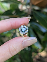 Load image into Gallery viewer, 1980s Halo ring with Teal sapphire and white spinel in 9ct yellow and white gold.