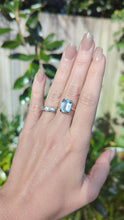 Load and play video in Gallery viewer, Serene bright pale blue aquamarine ring in 9ct yellow gold c1960s Birmighham

