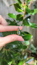 Load and play video in Gallery viewer, Australian harlequin parti sapphire band 9ct vintage yellow gold setting.
