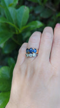 Load and play video in Gallery viewer, Striking natural blue sapphire trilogy in rosey 9ct yellow gold
