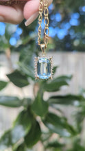 Load and play video in Gallery viewer, 1960s Aquamarine &amp; diamond pendant in 9ct yellow gold.
