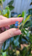 Load and play video in Gallery viewer, Striking natural blue sapphire trilogy in rosey 9ct yellow gold
