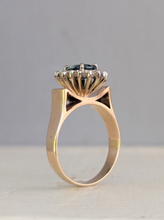 Load image into Gallery viewer, 1980s Halo ring with Teal sapphire and white spinel in 9ct yellow and white gold.
