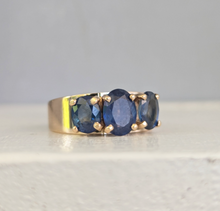 Load image into Gallery viewer, Striking natural blue sapphire trilogy in rosey 9ct yellow gold
