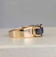 Load image into Gallery viewer, Striking natural blue sapphire trilogy in rosey 9ct yellow gold
