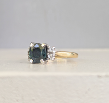Load image into Gallery viewer, Tantalising teal blue Australian sapphire in heavy 18ct yellow and white gold

