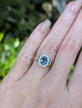 Load image into Gallery viewer, 1980s Halo ring with Teal sapphire and white spinel in 9ct yellow and white gold.
