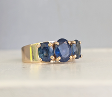 Load image into Gallery viewer, Striking natural blue sapphire trilogy in rosey 9ct yellow gold
