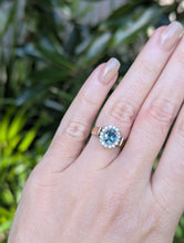 Load image into Gallery viewer, 1980s Halo ring with Teal sapphire and white spinel in 9ct yellow and white gold.
