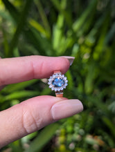 Load image into Gallery viewer, 1980s Halo ring with Teal sapphire and white spinel in 9ct yellow and white gold.
